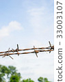 barbed wire on blue sky background 33003107