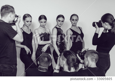 Photographers paparazzi take photos of women in 33005605