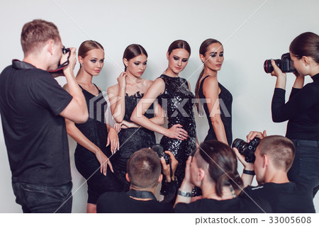 Photographers paparazzi take photos of women in 33005608