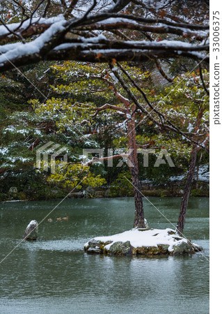 Kyoko Pond at Kinkakuji Temple with snow in Kyoto 33006375
