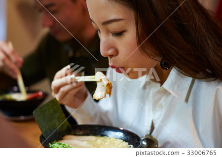 the girl is preparing to eat a slice of meat the girl is preparing to eat a slice of meat 33006765