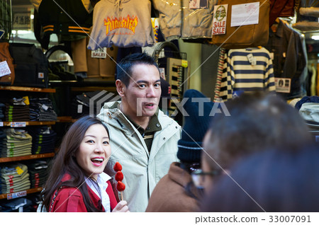 a photo of two people smiling and looking at something a photo of two people smiling and looking at something 33007091