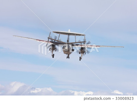 US Navy carrier-based E-2 C Hawkeye early warning aircraft flying in the blue sky 33008923