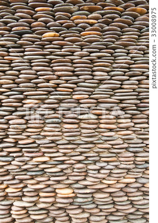 Close up of circle pebble wall,abstract background 33008975
