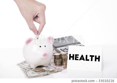 saving money in piggy bank for message health. 33010216
