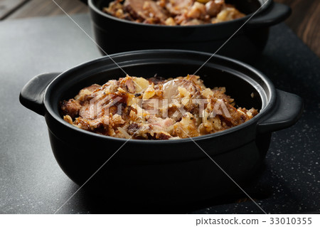 Potatoes baked with sausage and bacon Potatoes baked with sausage and bacon 33010355
