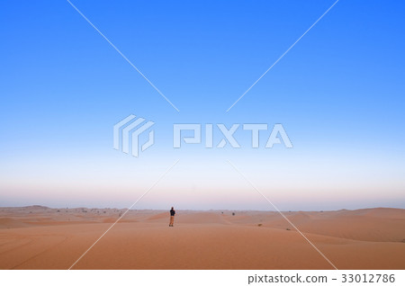Man in the vast desert Man in the vast desert 33012786
