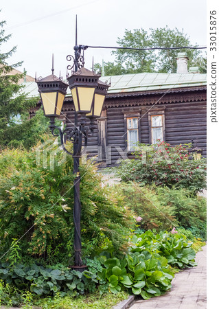retro lamp in the bushes on a background of old 33015876