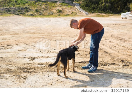 man with his dog 33017189