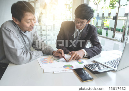 Business team two colleagues discussing working Business team two colleagues discussing working 33017682