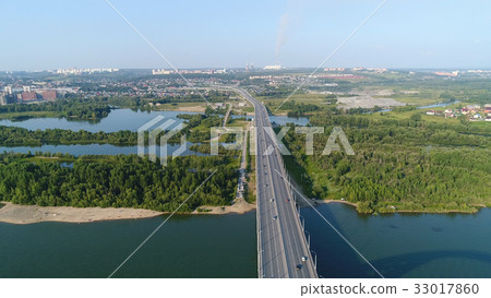 The flight of the drone over the river. The bridge The flight of the drone over the river. The bridge 33017860