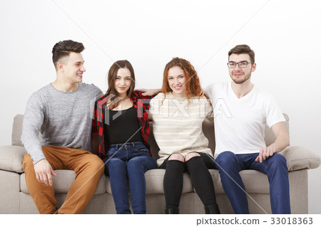 Happy young friends, casual people sitting on Happy young friends, casual people sitting on 33018363