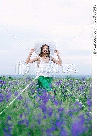Girl with a bouquet of lavender Girl with a bouquet of lavender 33018645