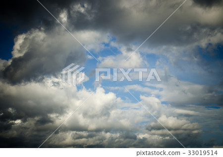Saturated clouds in the blue sky 33019514