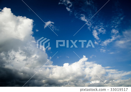 Saturated clouds in the blue sky 33019517