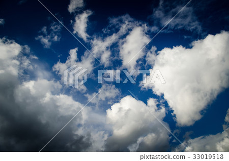 Saturated clouds in the blue sky 33019518