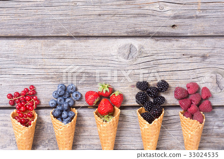 Berries in ice cream cone Berries in ice cream cone 33024535