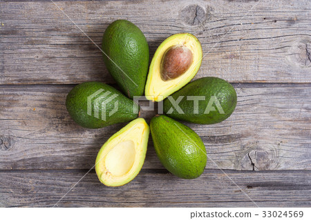 Fresh avocado on wooden background Fresh avocado on wooden background 33024569