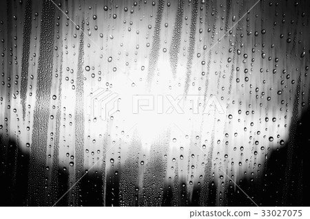 Water droplets on glass with black and white. Water droplets on glass with black and white. 33027075
