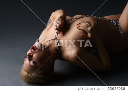 Woman with metal chain on neck getting orgasm Woman with metal chain on neck getting orgasm 33027086