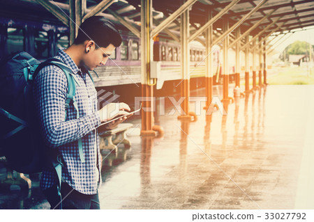 Asian man backpack for travel at train station Asian man backpack for travel at train station 33027792