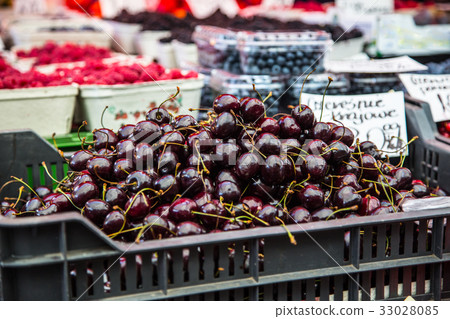 Cherries on the farm market in the city. Cherries on the farm market in the city. 33028085