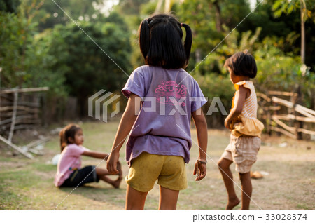 Children play and fun of kids in countryside 33028374