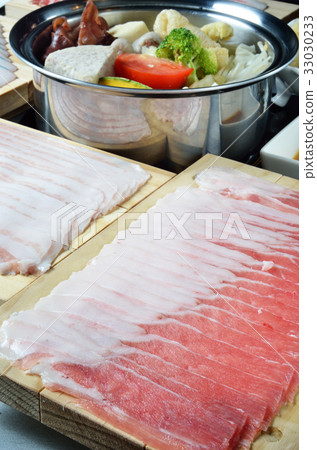 Raw pork slice on plate 33030233