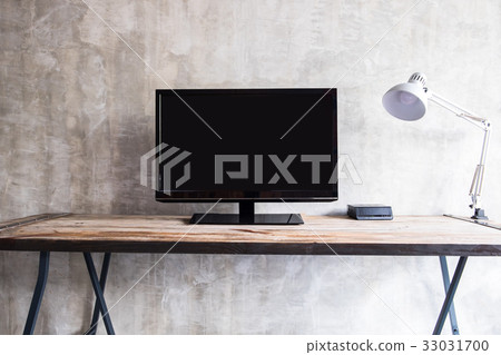 wide screen TV on table with lamp 33031700