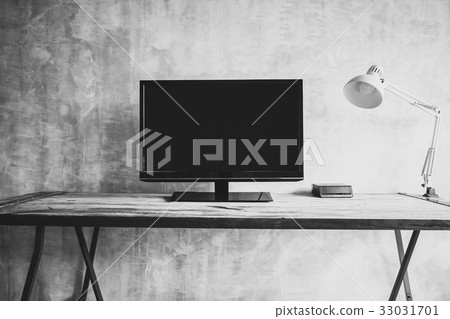 wide screen TV on table with lamp 33031701