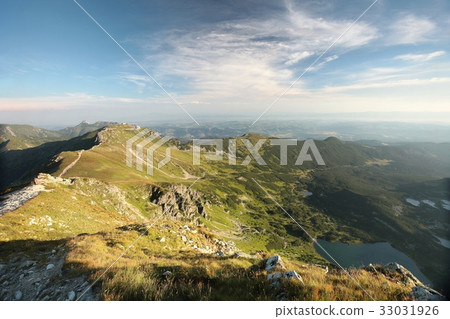 Tatra Mountains over the valley at dawn Tatra Mountains over the valley at dawn 33031926