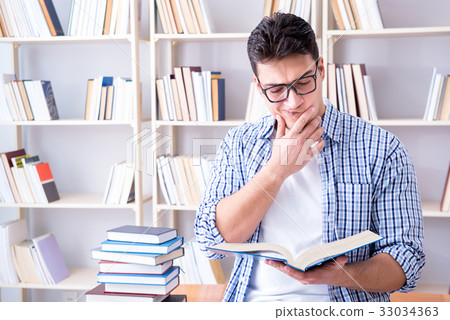 Young student with books preparing for exams Young student with books preparing for exams 33034363