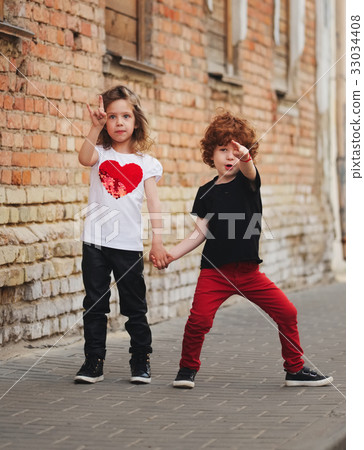 little boy and girl on the street little boy and girl on the street 33034408