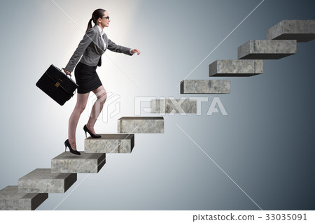 Businesswoman climbing career ladder in business 33035091