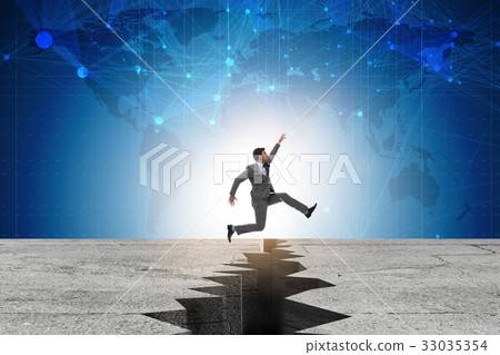 Businessman jumping over the cliff 33035354