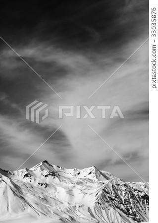 Black and white winter snowy mountain at windy day 33035876