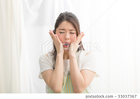 A woman in an apron A woman in an apron 33037367
