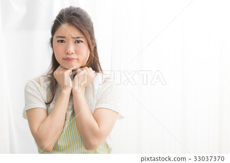 A woman in an apron A woman in an apron 33037370