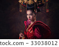 Asian woman in Chinese tradition dress 33038012