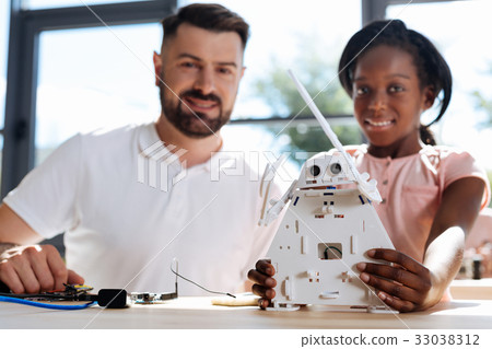 Teacher and student posing with a new robot Teacher and student posing with a new robot 33038312