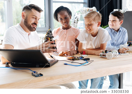 Pleasant robotics specialist conducting a workshop Pleasant robotics specialist conducting a workshop 33038330