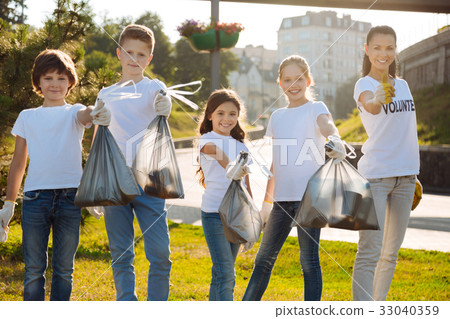 Enterprising volunteers being proud of done task 33040359