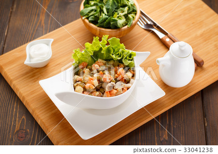 Russian salad Olivier on a white plate 33041238