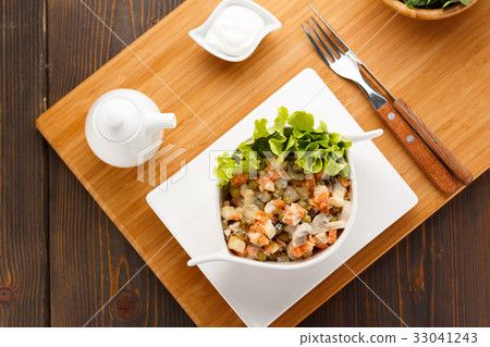 Russian salad Olivier on a white plate Russian salad Olivier on a white plate 33041243