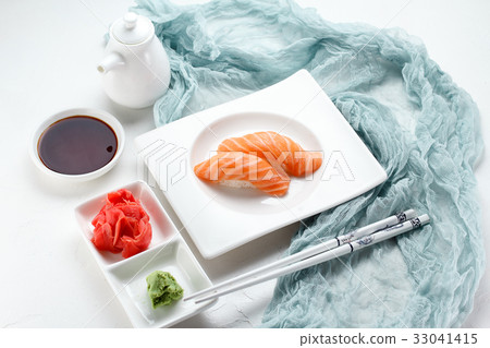 Japanese cuisine. Sushi on a white plate 33041415