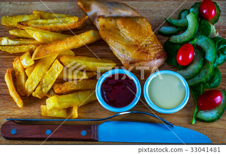 Roast chicken breast with chips Roast chicken breast with chips 33041481