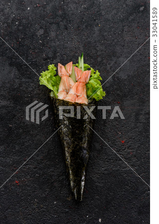 Shrimp handmade sushi (temaki) on a stone plate. 33041589