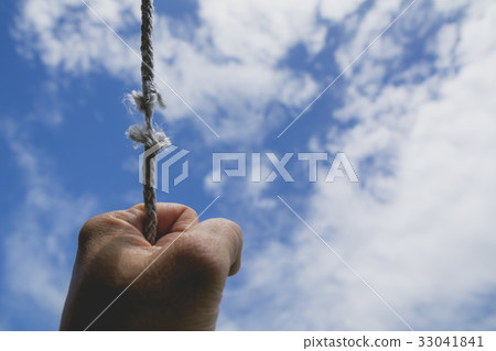 hand of man holding on to the rope hand of man holding on to the rope 33041841