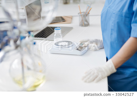 Close up of electronic scales being in use 33042527