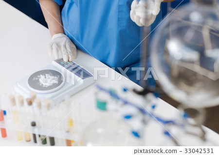 Nice female scientist pressing a button 33042531